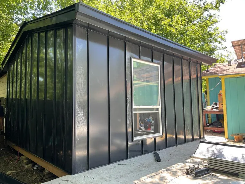 Black standing seam metal wall panels for Roof Inspection in East Point